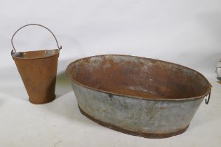 A galvanised metal oval trough and a half gallon hopper, 82 x 62cm