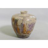 A studio pottery vase, decorated in lustre glaze with a landscape, unsigned, 17cm high