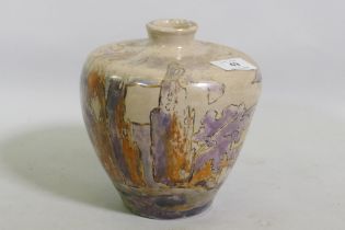 A studio pottery vase, decorated in lustre glaze with a landscape, unsigned, 17cm high