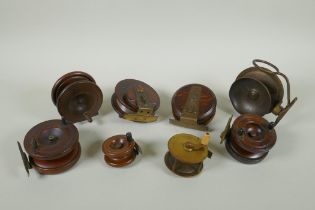 Eight antique wood and brass fly fishing reels