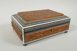 An Anglo Indian Vizagapatam carved sandalwood box with micro mosaic inlay and depictions of Hanuman,