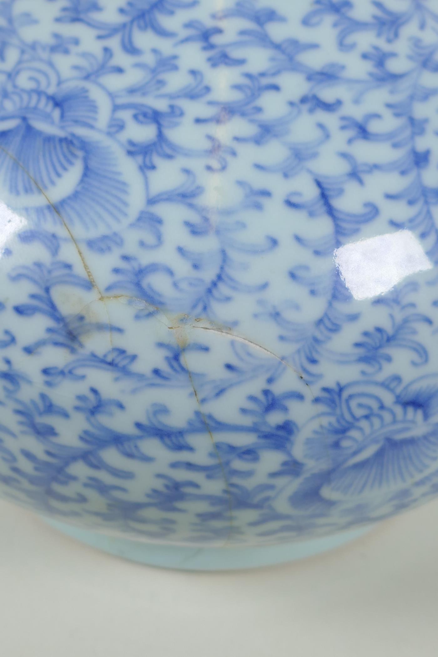 A C19th Chinese blue and white porcelain bottle vase with scrolling floral decoration, AF repair, - Image 4 of 6