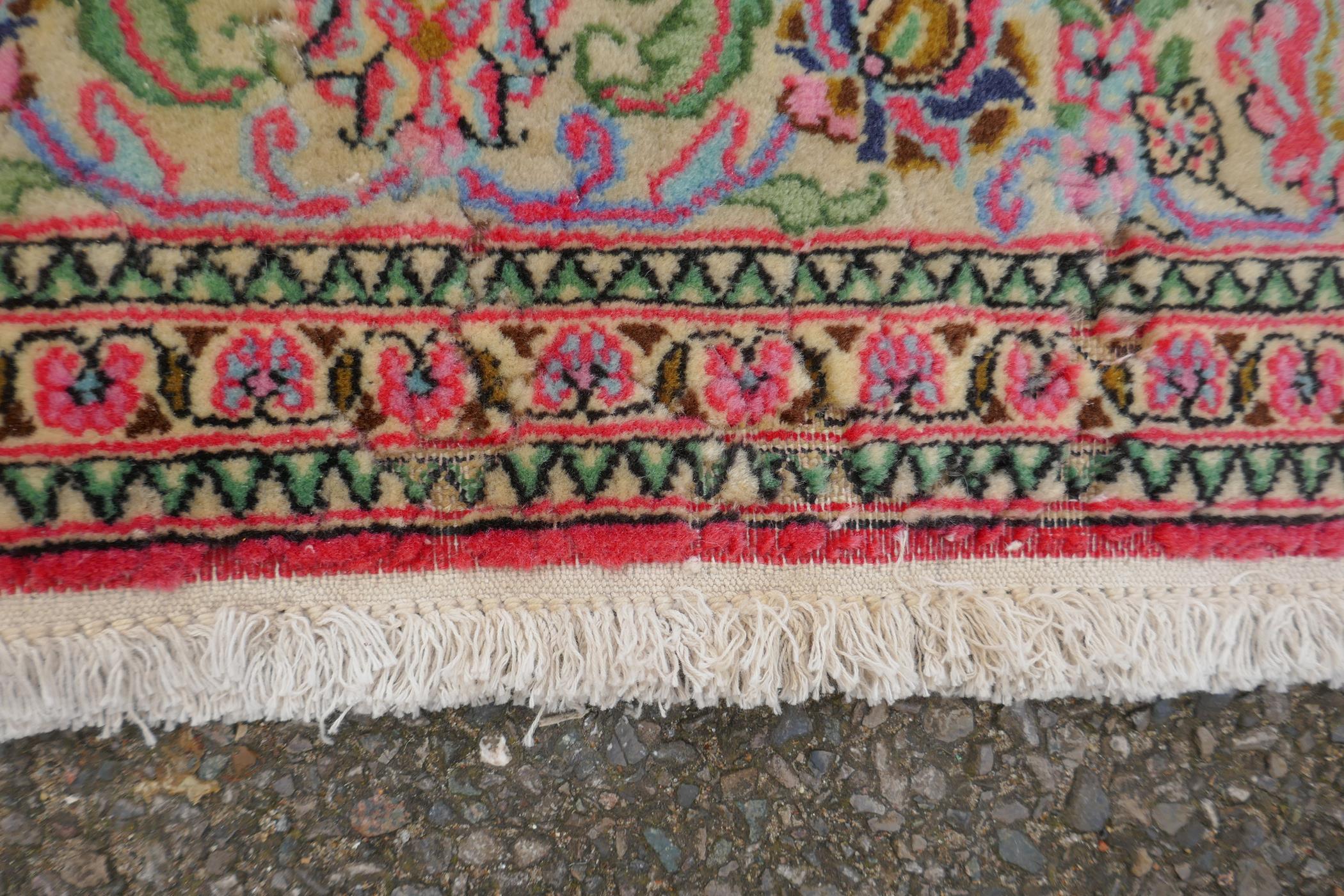 A very fine hand woven Persian Kashan rug with floral medallion design on a pink field, patched, 172 - Image 6 of 9