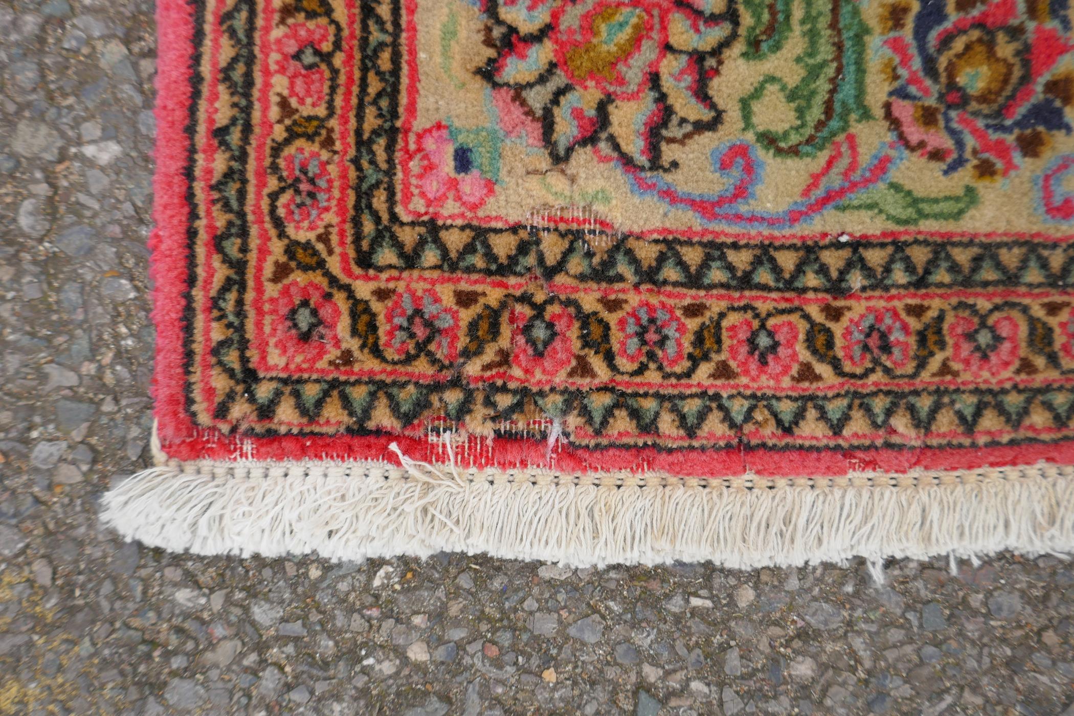 A very fine hand woven Persian Kashan rug with floral medallion design on a pink field, patched, 172 - Image 7 of 9