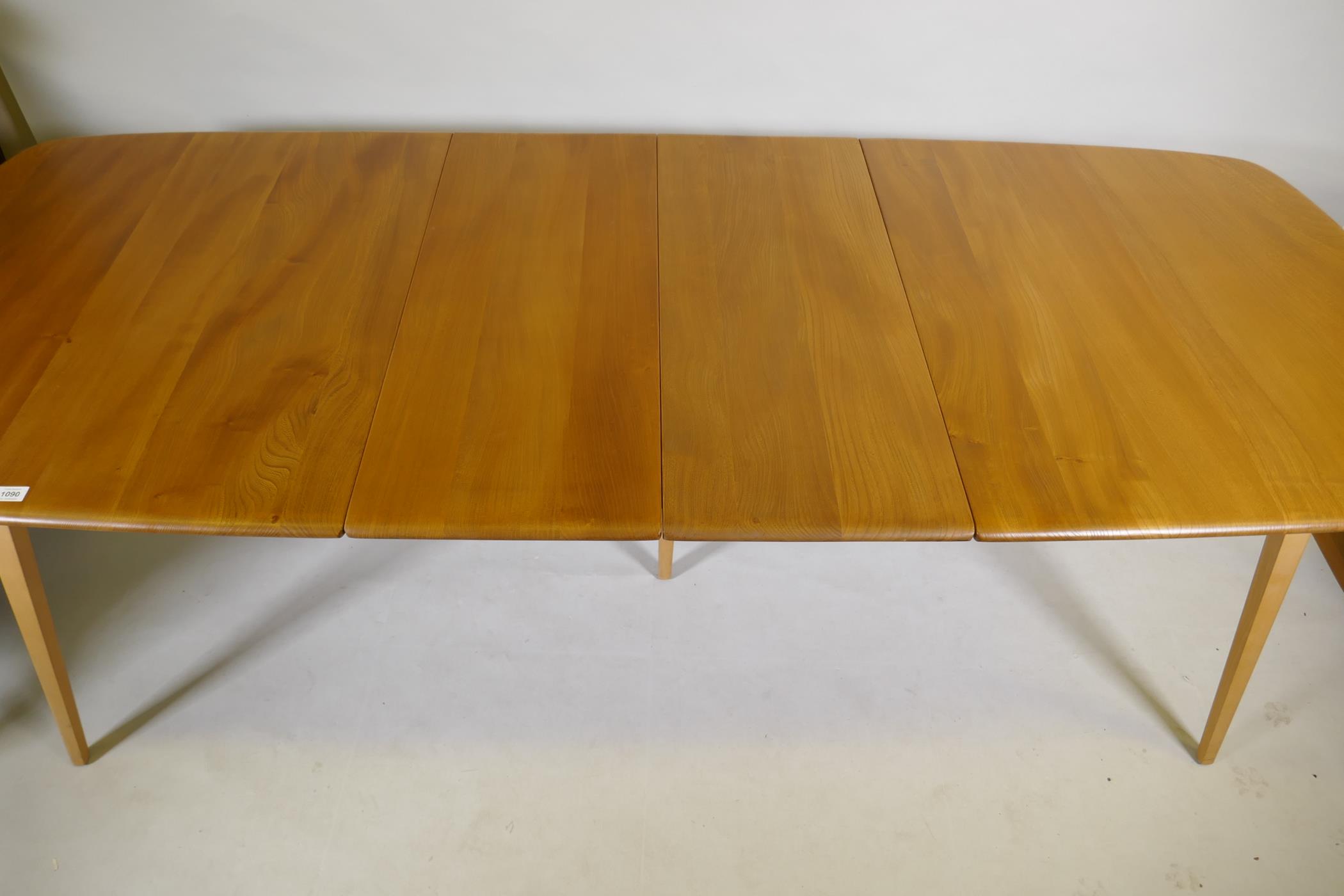 An Ercol Grand Windsor blond elm and beech extending dining table Model 444, and six matching Ercol - Image 8 of 8