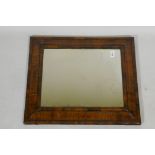 A William and Mary well figured walnut veneered cushion mirror with antique glass, 59 x 50cm