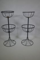 A pair of metal two tier garden basket planter holders, 88cm high