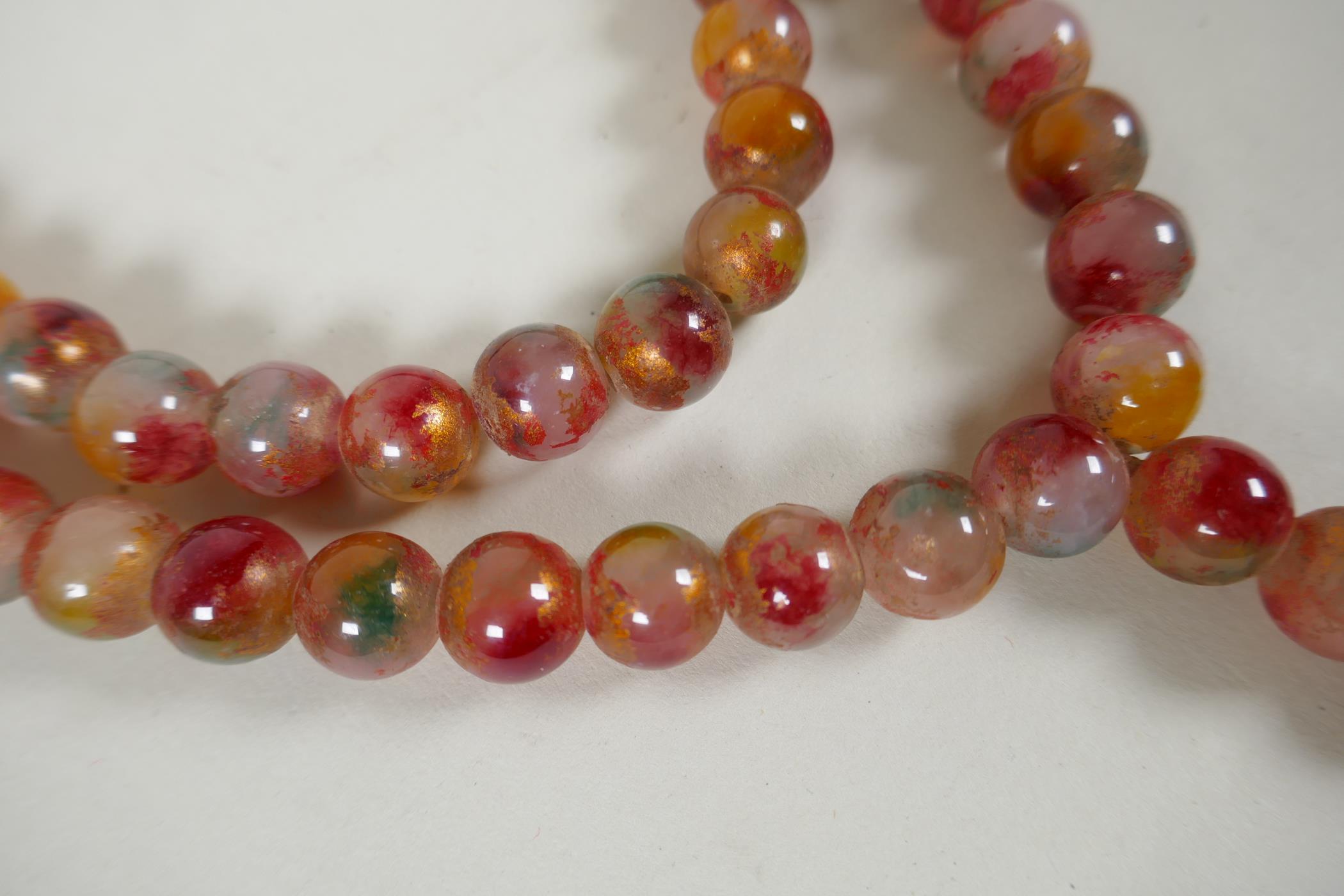A string of multicolour hardstone/jade mala beads with the remnants of gilt lustre, 122cm long - Image 2 of 6