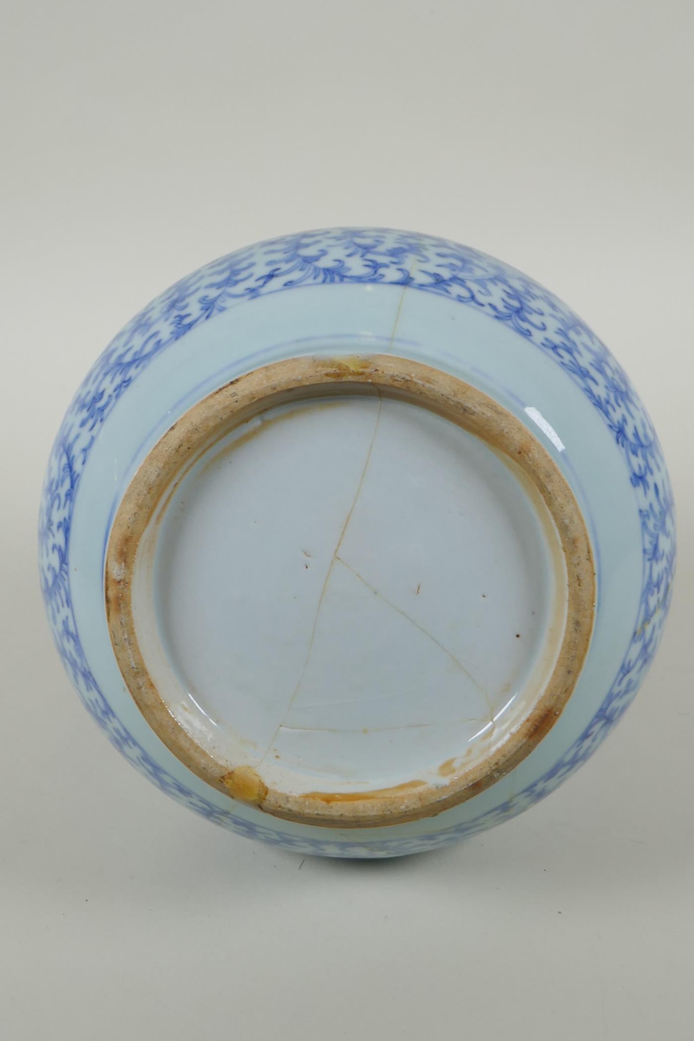 A C19th Chinese blue and white porcelain bottle vase with scrolling floral decoration, AF repair, - Image 5 of 6