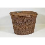 An antique wicker laundry basket, 77 x 60 x 55cm
