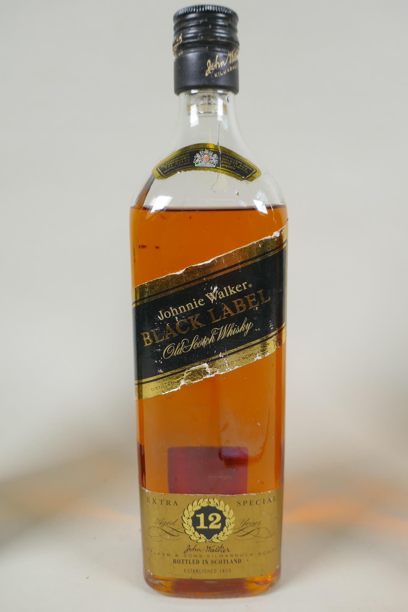 Four vintage bottles of spirits, to include two bottles of Johnnie Walker Red Label Old Scotch - Image 4 of 5