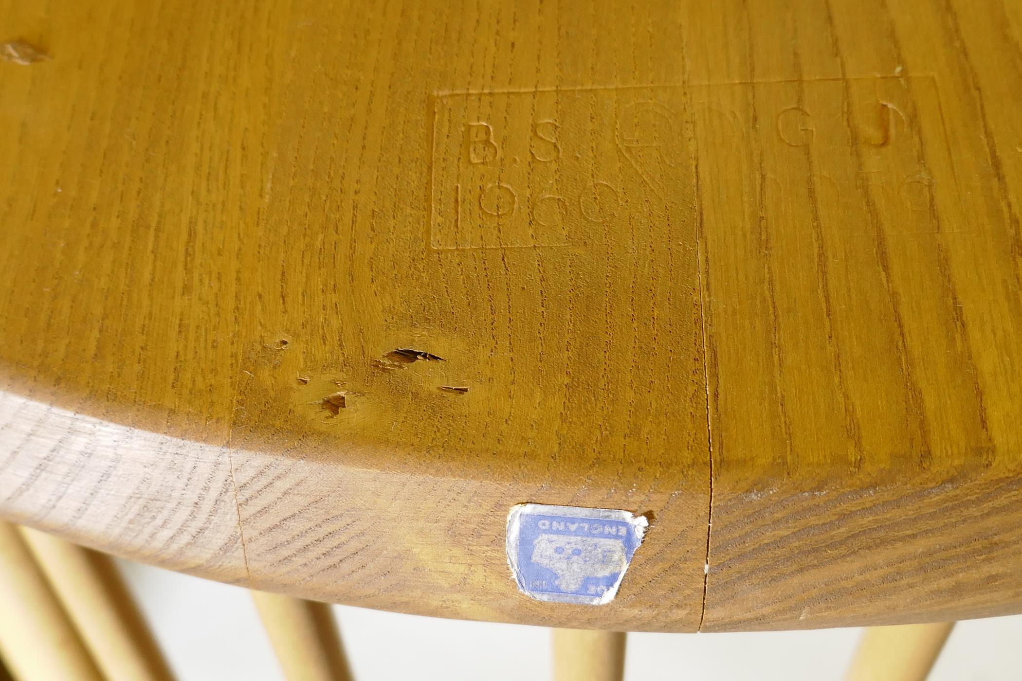 An Ercol Grand Windsor blond elm and beech extending dining table Model 444, and six matching Ercol - Image 4 of 8
