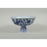 A Chinese blue and white porcelain stem bowl with lobed rim, decorated with phoenix and lotus