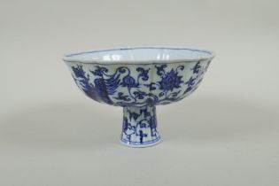 A Chinese blue and white porcelain stem bowl with lobed rim, decorated with phoenix and lotus