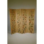 An antique Arts & Crafts style four fold screen, with embroidered crewel work designs of flowers and