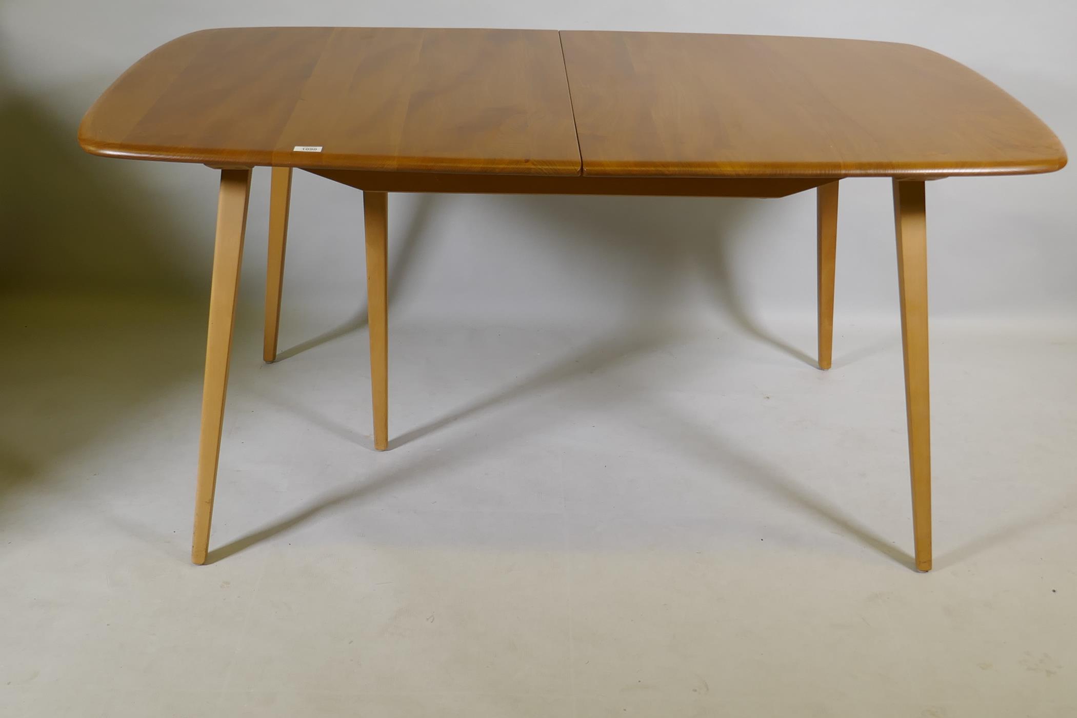 An Ercol Grand Windsor blond elm and beech extending dining table Model 444, and six matching Ercol - Image 5 of 8