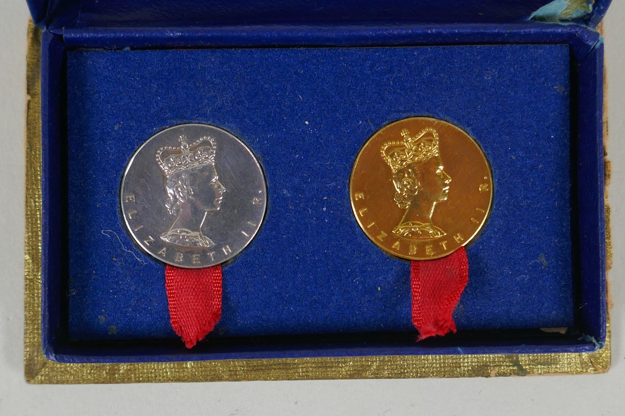 A pair of 9ct gold and silver Elizabeth II commemorative coins, in a fitted box, gold coin 6.5g, - Image 2 of 6