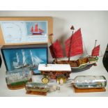 A kit built model of the whaler Charles W. Morgan in a glass display case, a 1:48 scale model kit of