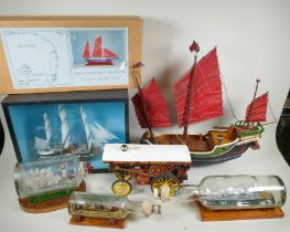 A kit built model of the whaler Charles W. Morgan in a glass display case, a 1:48 scale model kit of