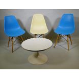 A set of three Eames style dining chairs and a small occasional table