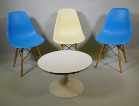 A set of three Eames style dining chairs and a small occasional table