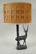 An African carved hardwood antelope lamp, 56cm high