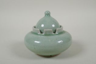 A Chinese celadon crackle glazed porcelain censer and cover, 11cm diameter