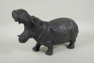 A bronzed metal hippopotamus, 34cm long