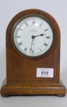 An Edwardian mahogany dome cased mantel clock, the enamel dial with Roman numerals inscribed