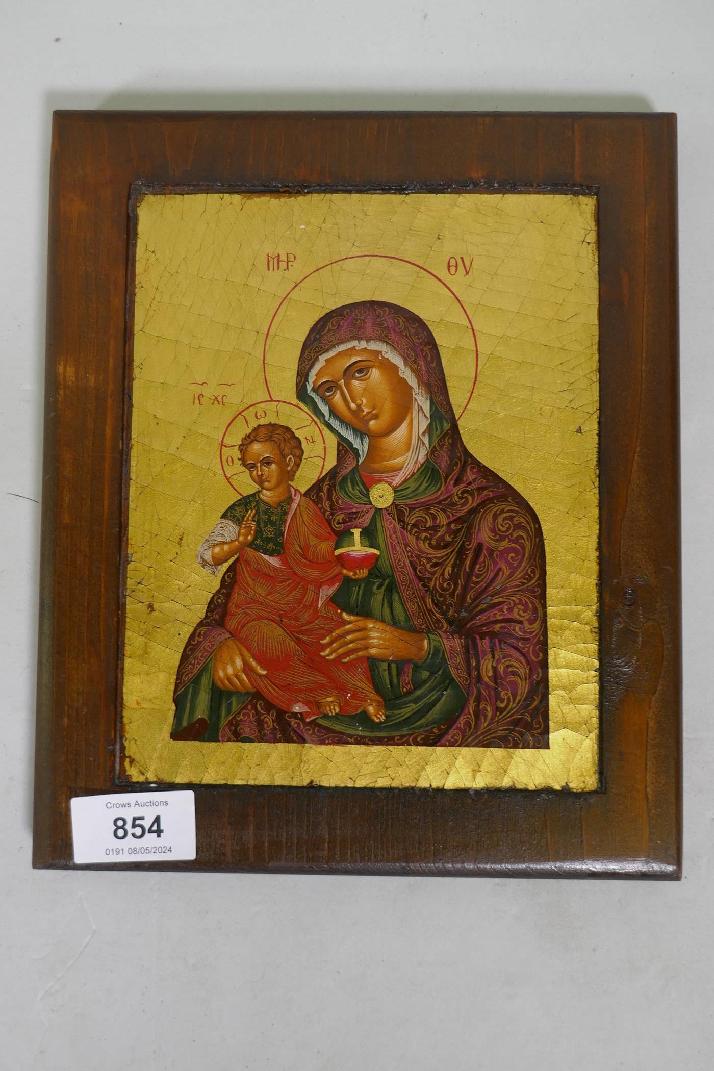 A hand painted and gilded icon, late C20th, 15 x 19cm