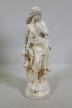 A painted reconstituted garden statue of a female water carrier, 67cm high
