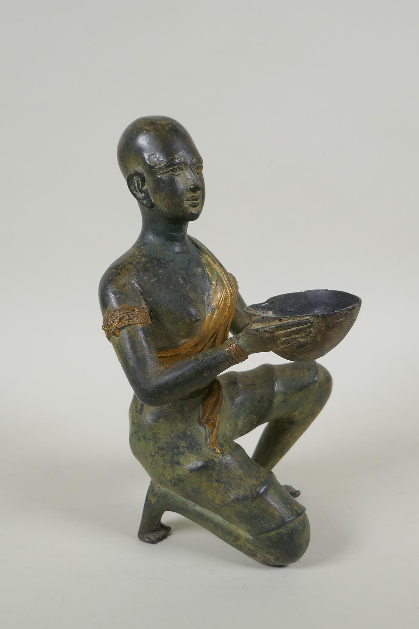 An antique oriental filled bronze figure of a kneeling woman carrying a bowl, 24cm high - Image 2 of 4