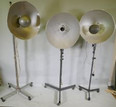 A pair of industrial RRB floor standing studio lamps, and a similar Malham lighting equipment SE23