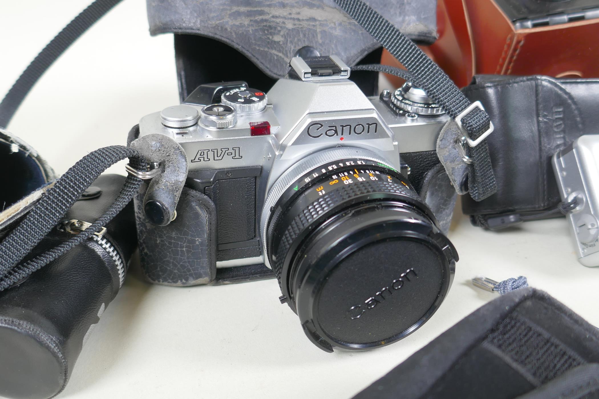 A quantity of vintage 35mm and medium format cameras and accessories, to include a Canon AV-1, a - Image 2 of 8