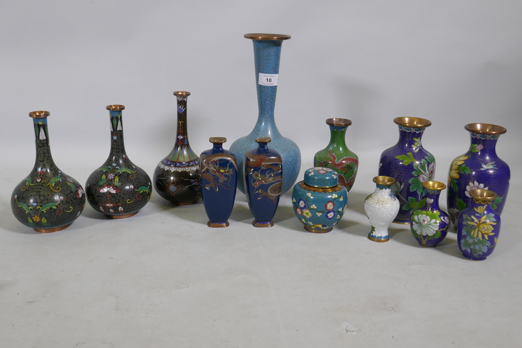 A collection of Chinese cloisonne vases with dragon and floral decoration, largest 31cm high