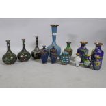 A collection of Chinese cloisonne vases with dragon and floral decoration, largest 31cm high