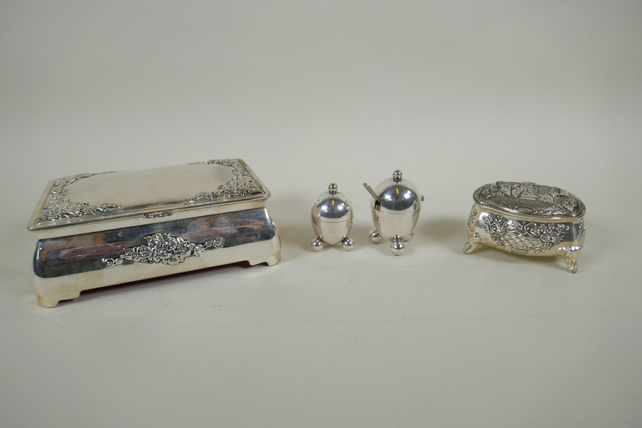 A pair of Mappin & Webb silver plated salts, a silver plated bombe shaped jewellery casket and a