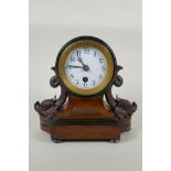 A C19th German mahogany cased mantel clock by Reinhold Schnekenburger, decorated with carved