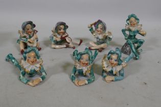 A set of seven porcelain pixies, mid C20th, made in occupied Japan stamp, 9cm high