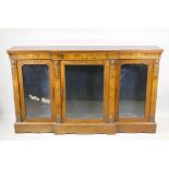 A Victorian marquetry inlaid breakfront walnut credenza with moulded frieze top over three arched