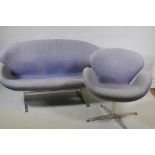 A contemporary egg shaped swivel chair with chrome supports, and matching two seater settee, 140cm