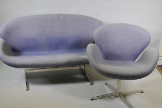 A contemporary egg shaped swivel chair with chrome supports, and matching two seater settee, 140cm