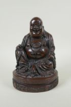 A Chinese bronzed composition figure of a jolly Buddha, 23cm high