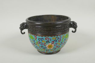 A Chinese bronze two handled censer with cloisonne lotus flower decoration, impressed seal marks