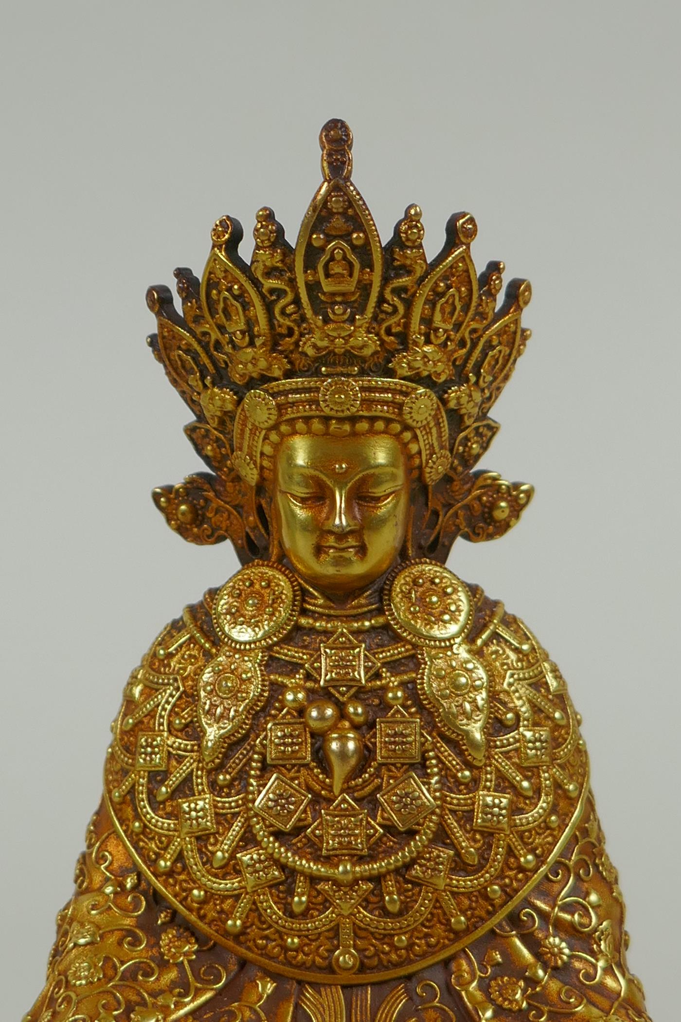 A Sino Tibetan filled gilt bronze Buddha seated on a lotus throne, double vajra mark to base, 11cm - Image 2 of 6