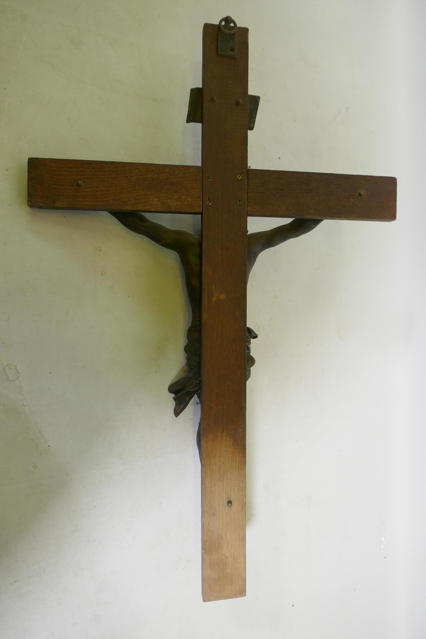 A C19th Continental bronze Corpus Christi, mounted on an oak crucifix with tablet, marked AA, - Image 4 of 6