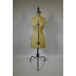 A vintage tailor's dummy, bust size 32-39", raised on metal swivel base, 150cm high