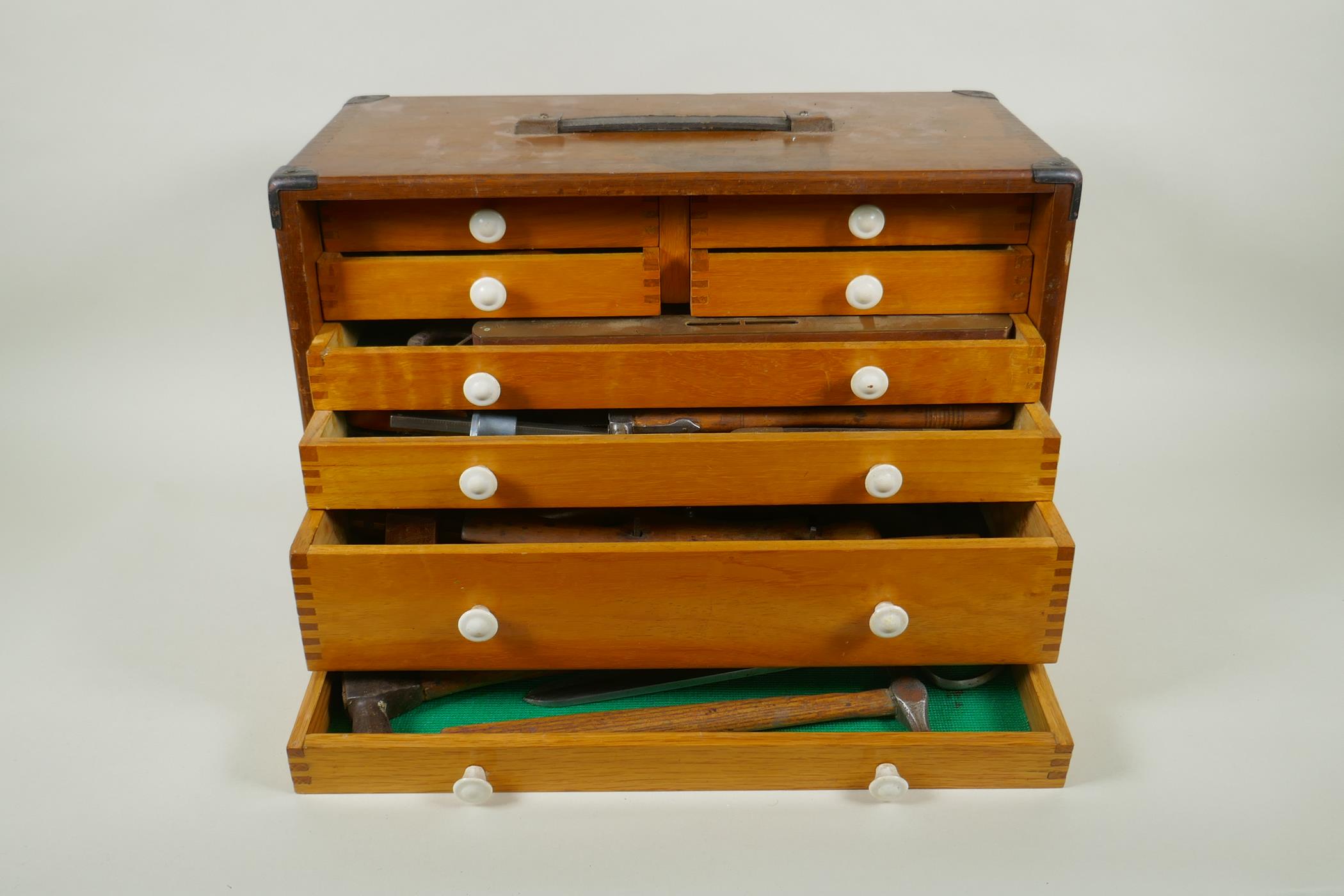 A vintage engineer's metal mounted tool chest with contents, 43 x 22cm, 29cm high