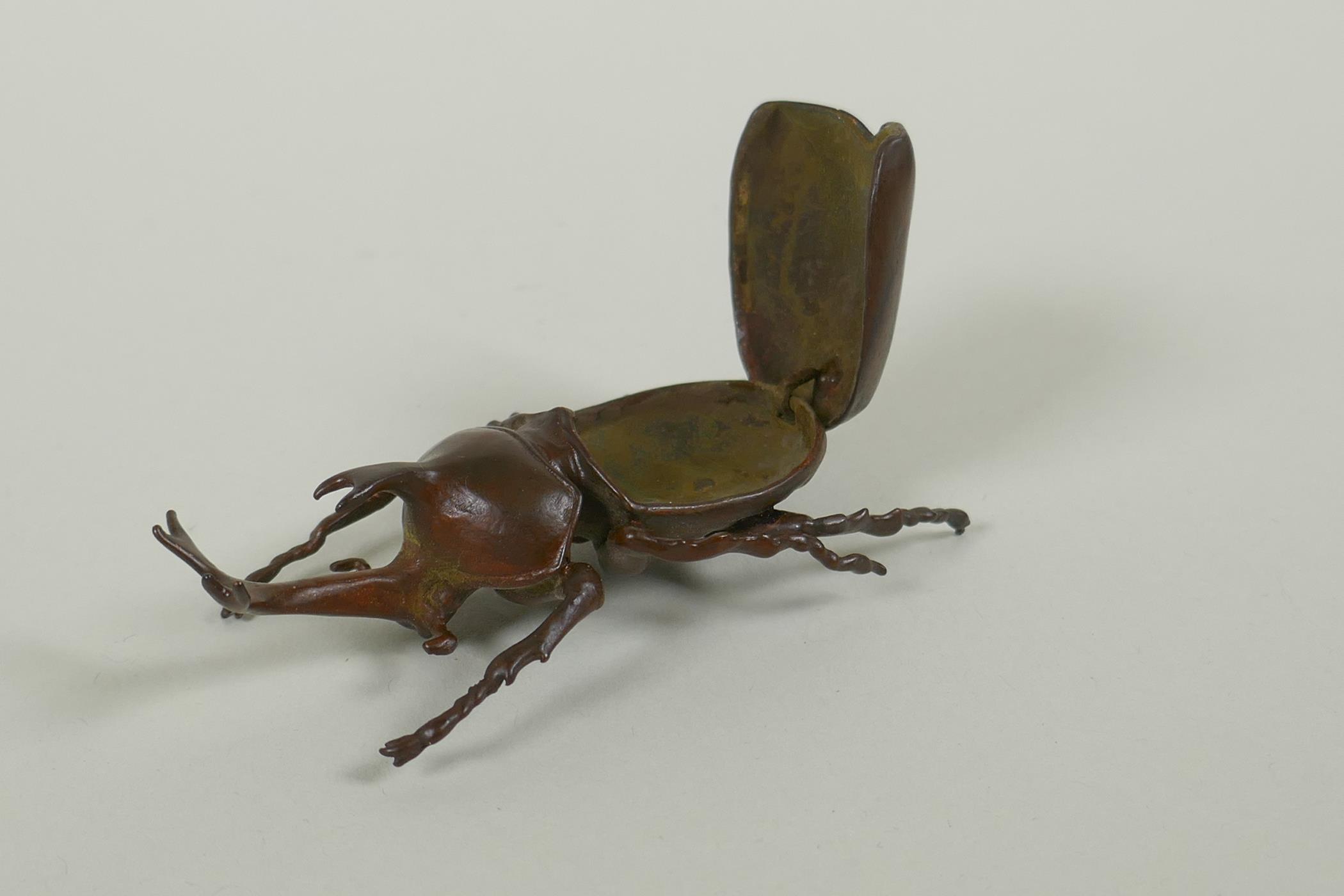 A Japanese style bronze okimono rhinoceros beetle, 9cm long - Image 3 of 3