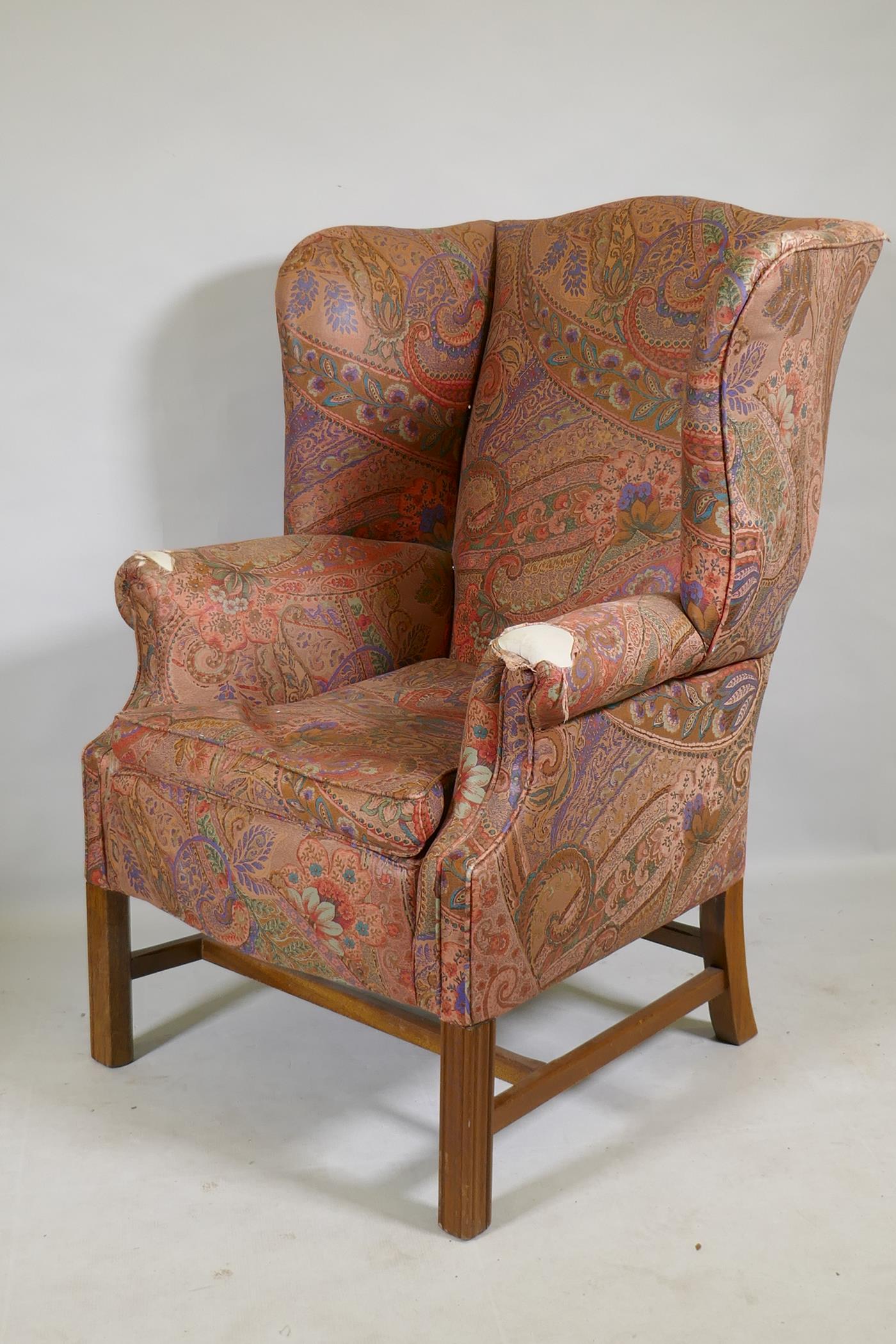 A Georgian style wingback armchair
